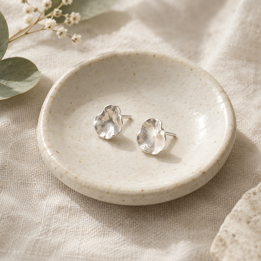 Petite irregular petal shaped sterling silver stud earrings