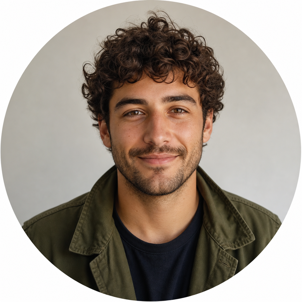 Portrait of Mateo Ibarra with curly brown hair, olive jacket, and a relaxed expression