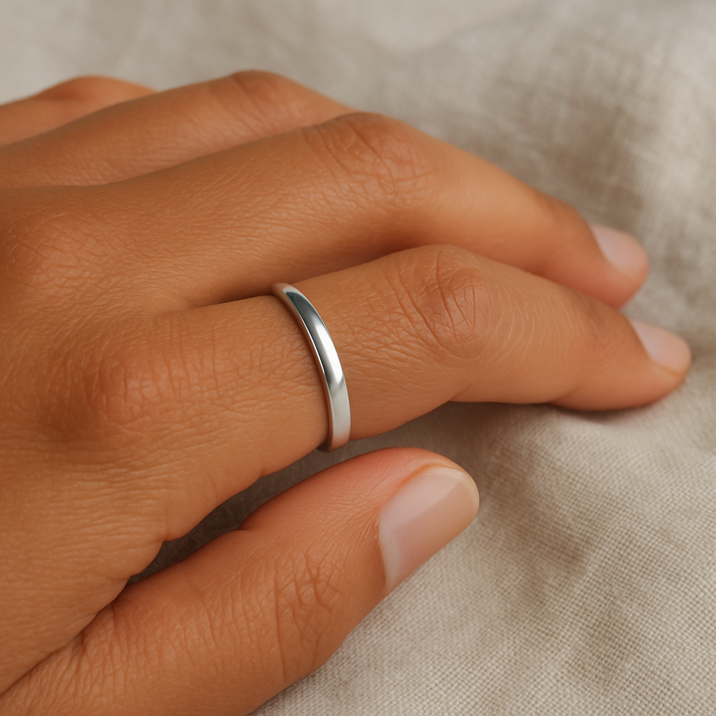 Fine silver stacking ring worn on a hand