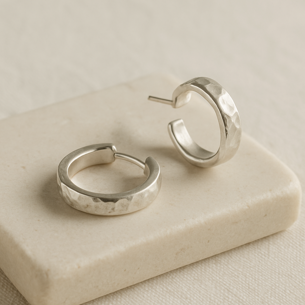 Close-up of textured silver hoop earrings