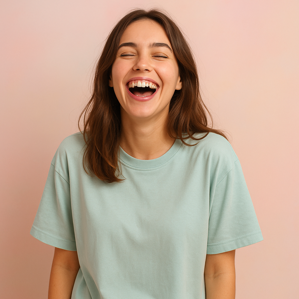 Customer wearing pastel tee, laughing