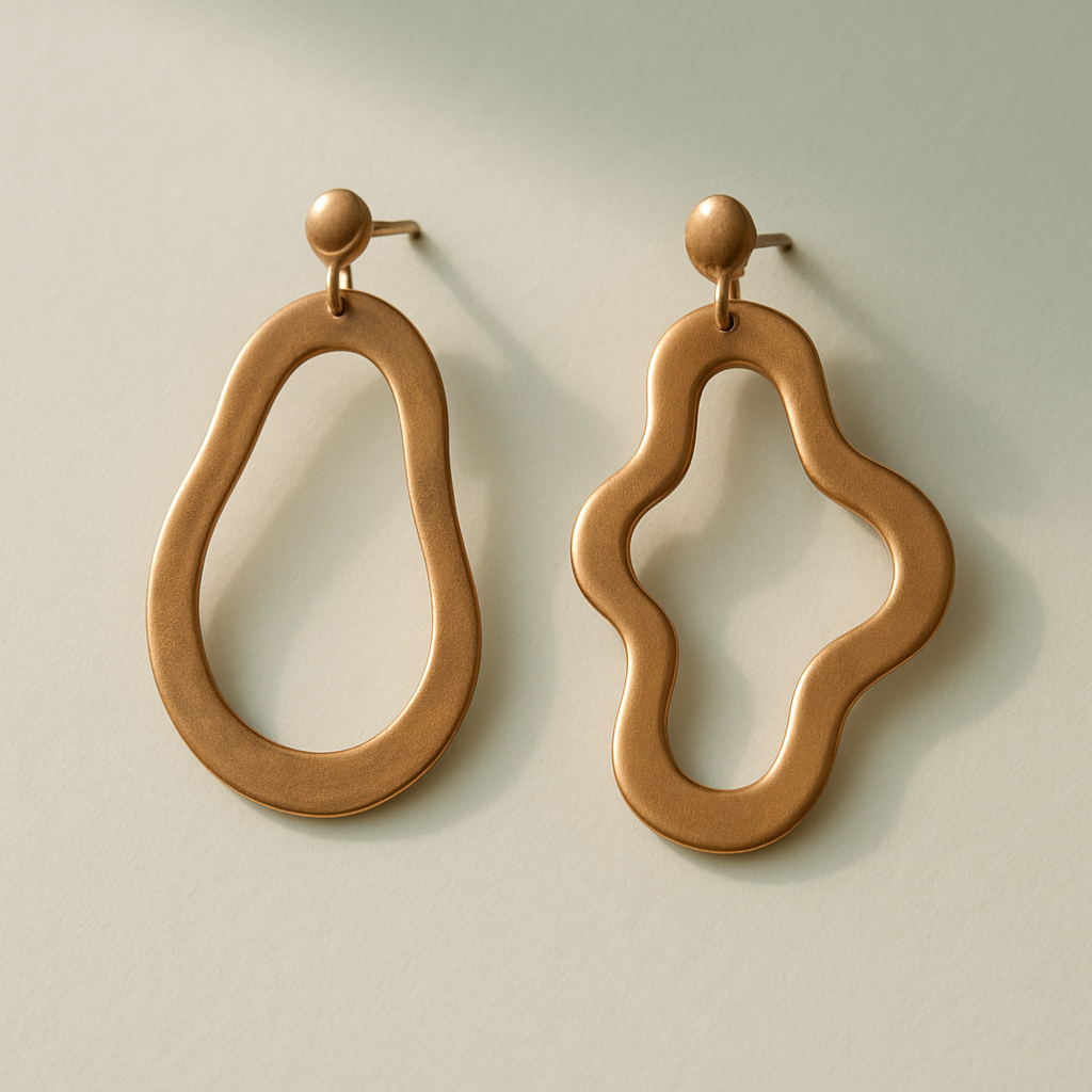 Pair of artisan earrings in warm light