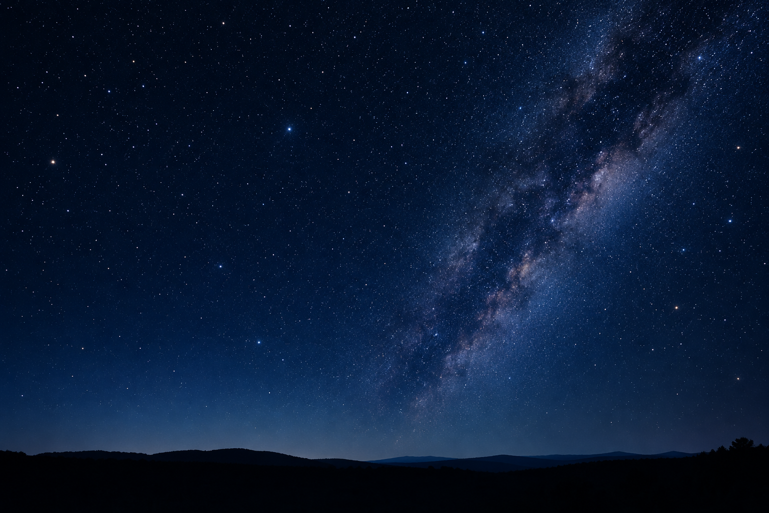 Clear star-filled night sky above a dark horizon with gentle atmospheric glow, suitable for amateur stargazing