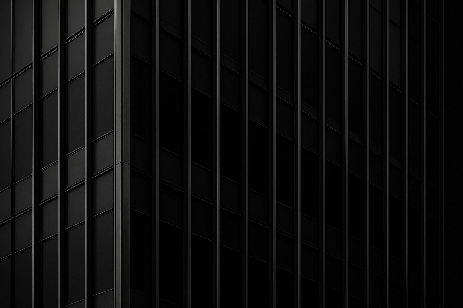 Monochrome close-up of a modern office tower facade with repeating steel lines and dark reflective glass