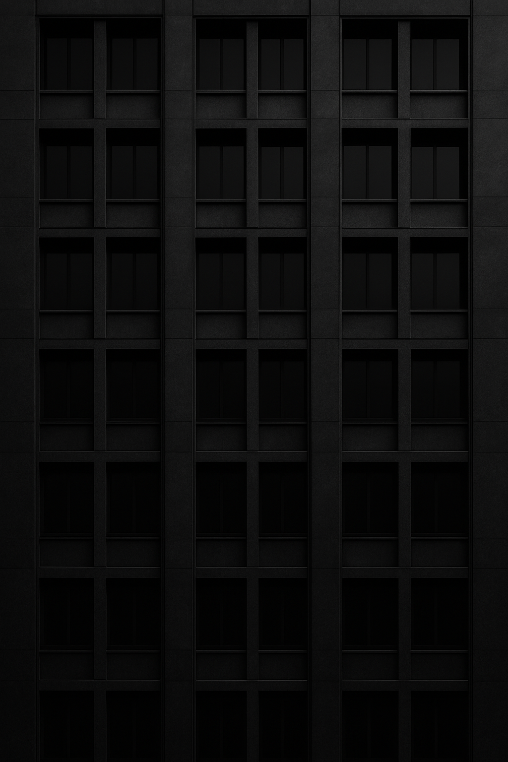 Monochrome architectural tower facade with geometric windows and shadowed structural lines