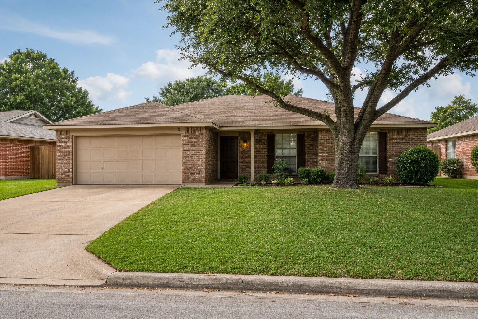 Single-story brick home on a quiet Dallas-Fort Worth neighborhood street with modest front yard and practical curb appeal