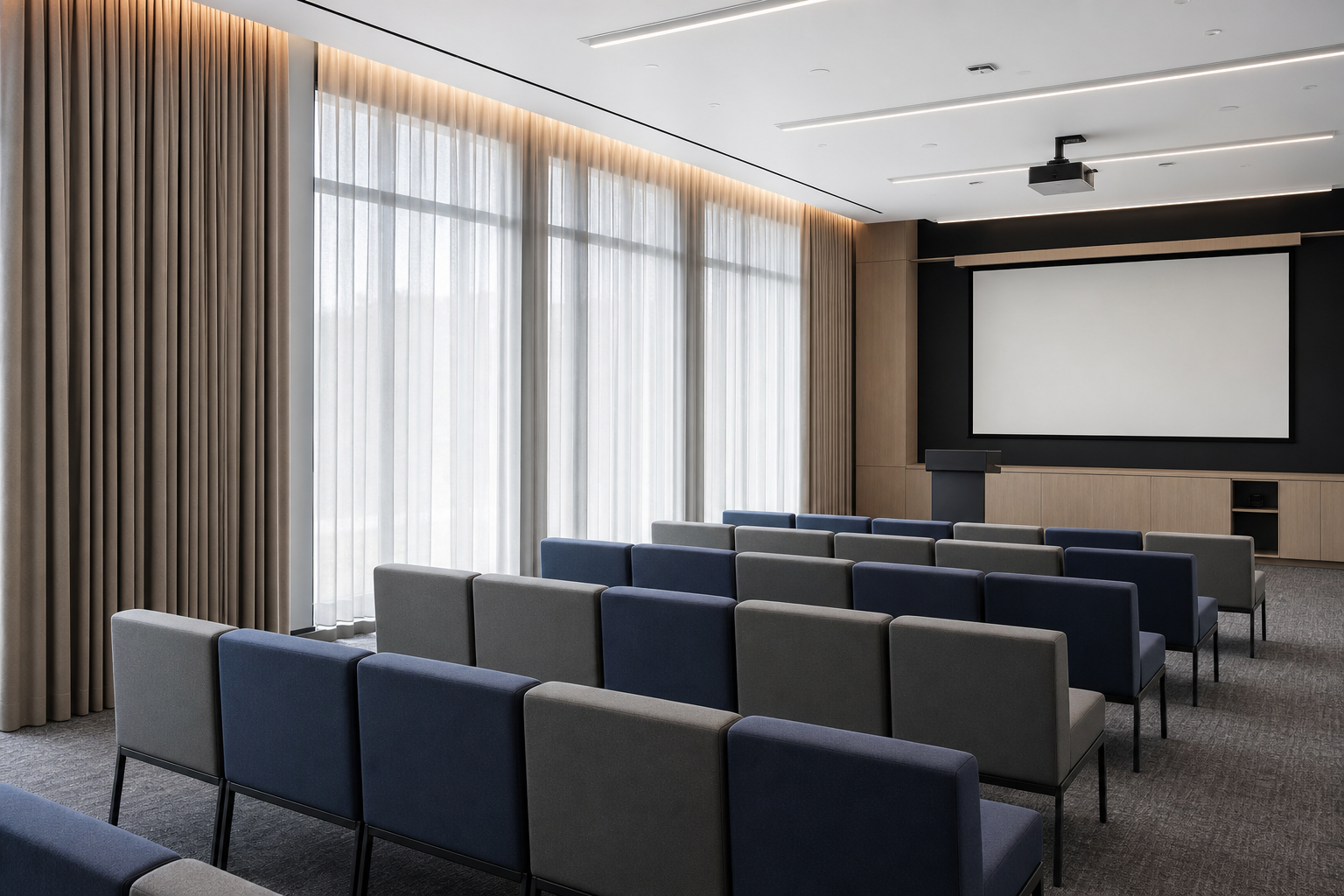 Commercial training room interior with functional curtains, modular seating, presentation wall, and balanced artificial and natural light