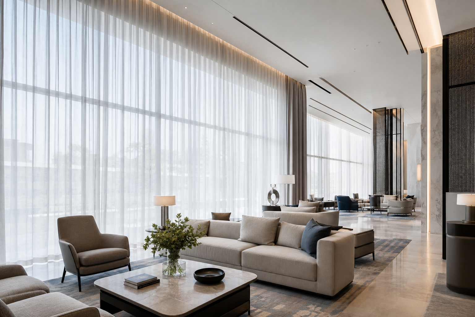 Hospitality lounge with floor-to-ceiling sheer curtains filtering soft daylight