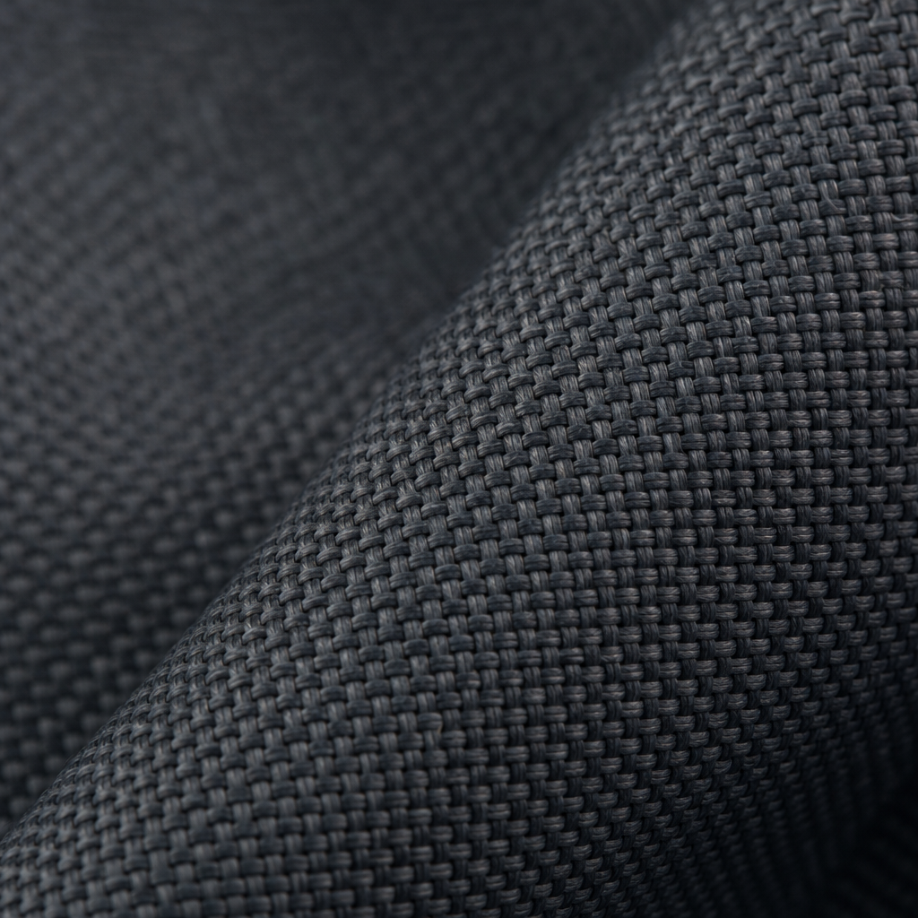 Close-up detail of woven inherent flame-retardant curtain textile with subtle matte texture