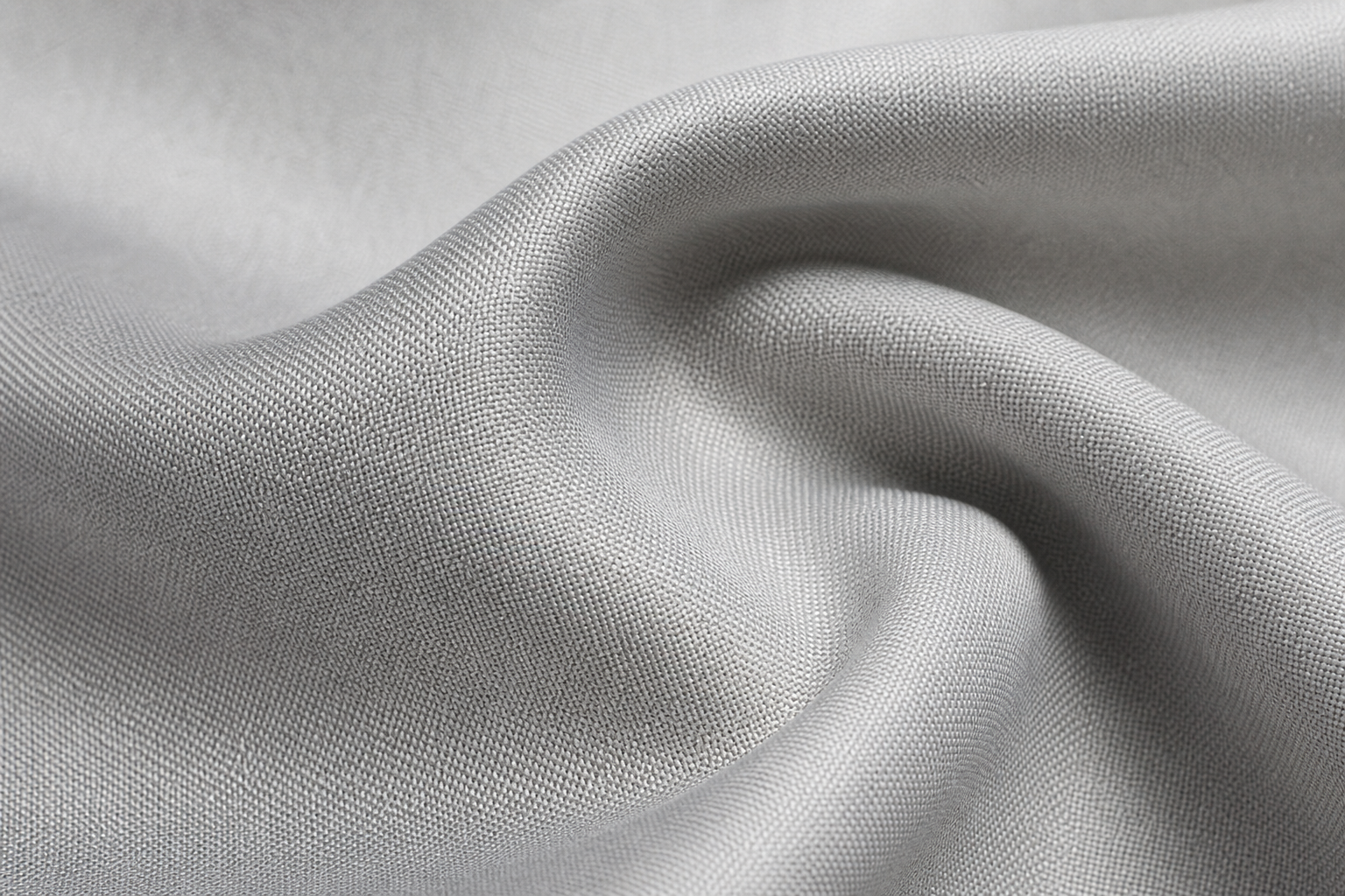 Close-up of light silver-gray antibacterial curtain fabric with fine technical weave and clean matte finish