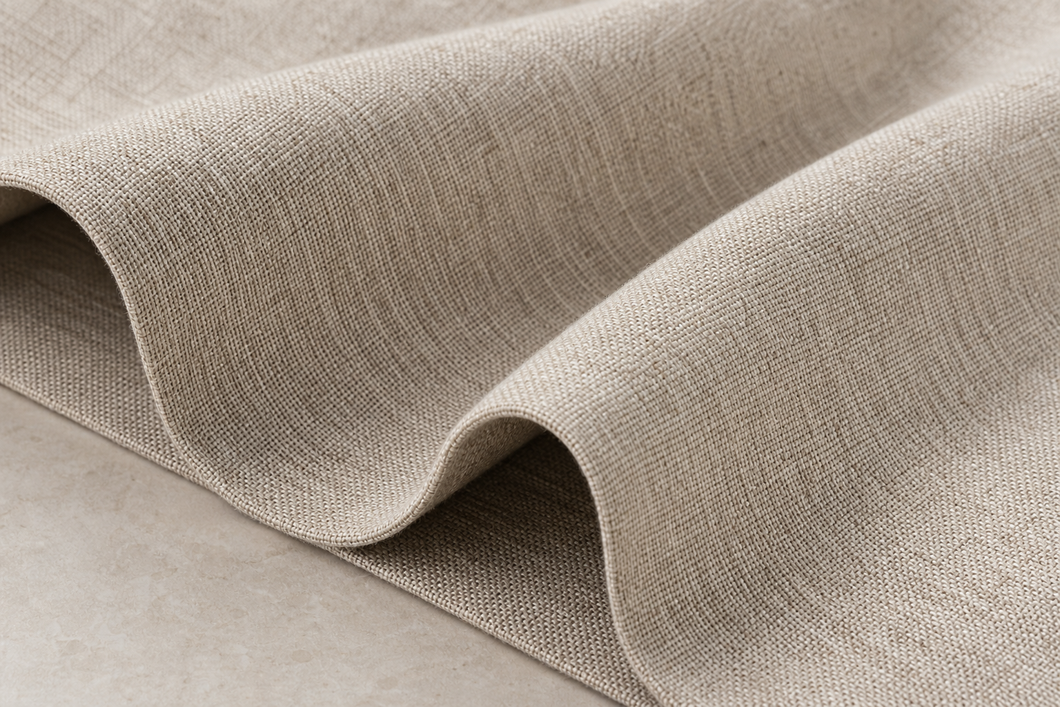 Macro view of warm stone-beige antibacterial melange curtain fabric with refined texture for contract interiors