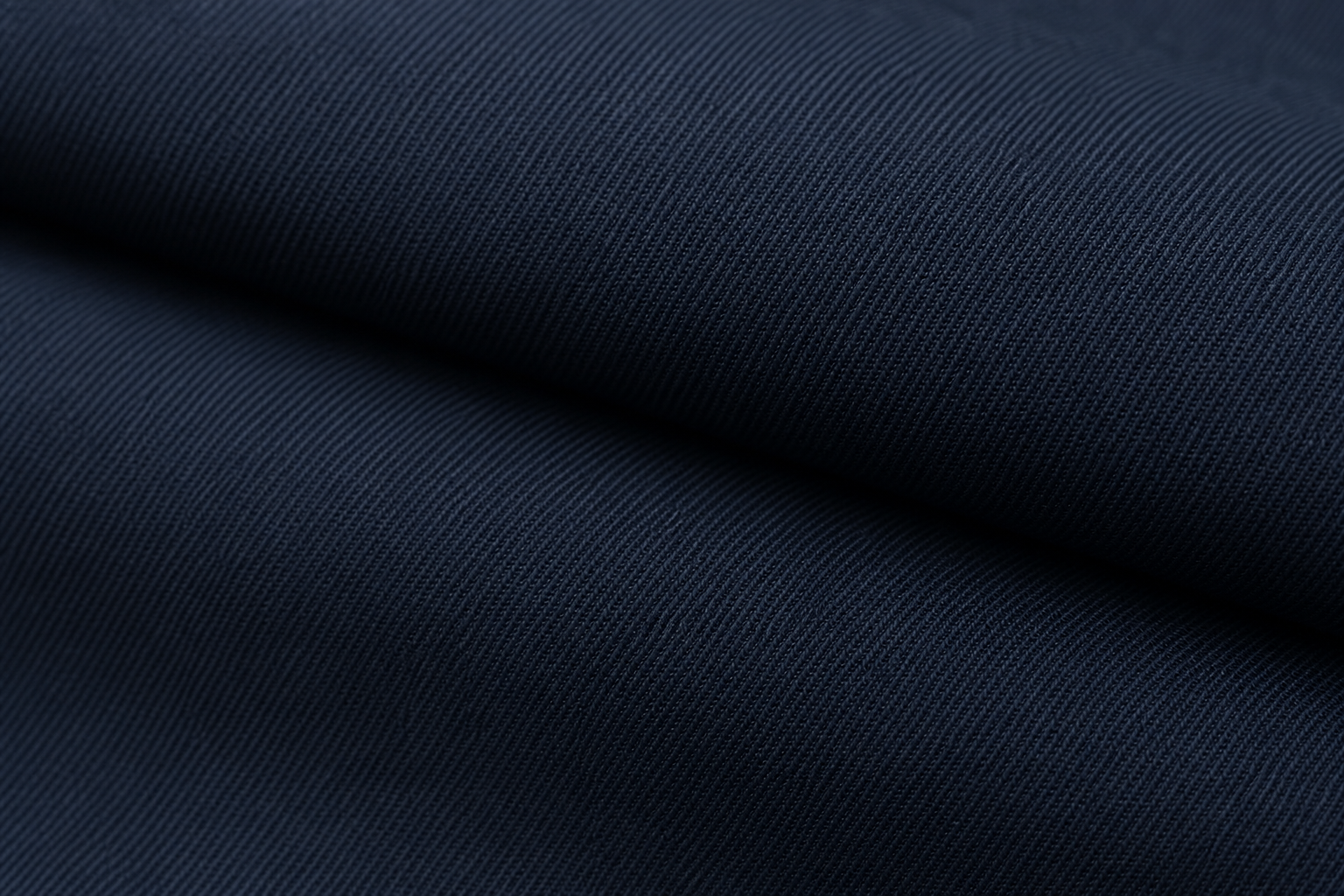 Detailed texture shot of deep navy twill inherent flame retardant blackout curtain fabric