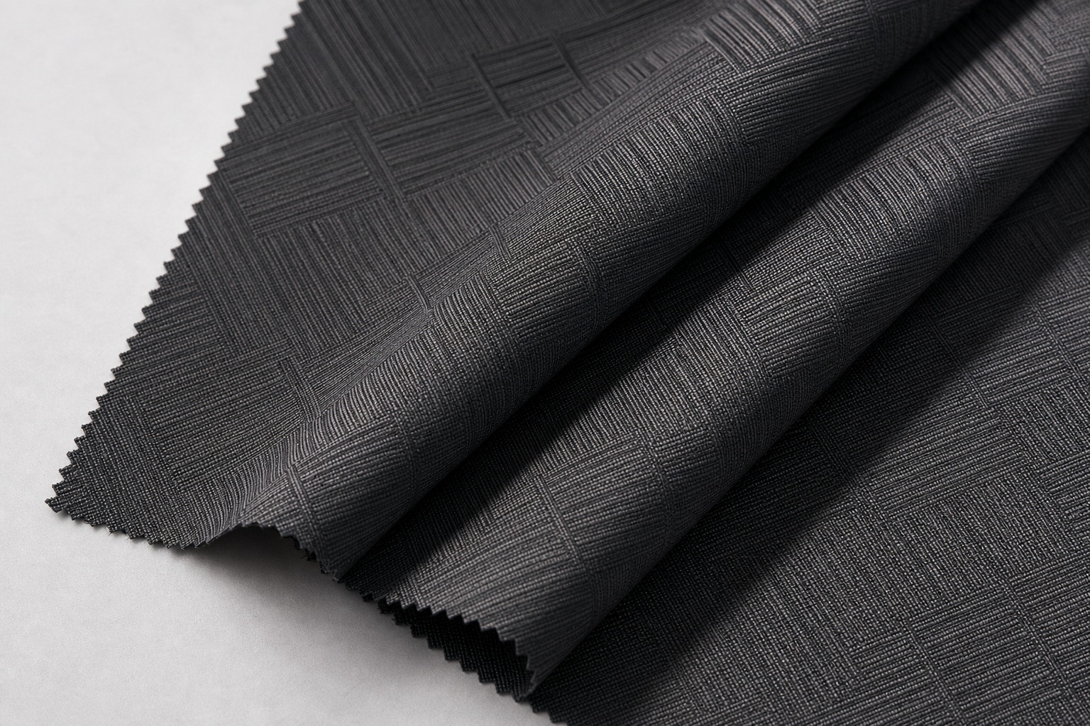 Inherent flame retardant jacquard curtain textile in charcoal gray with geometric woven relief