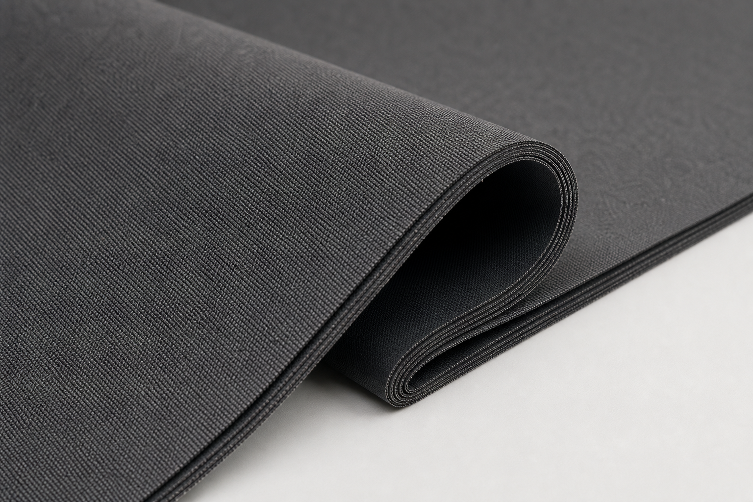 Matte inherent flame retardant blackout textile in neutral graphite with dense multilayer cross section