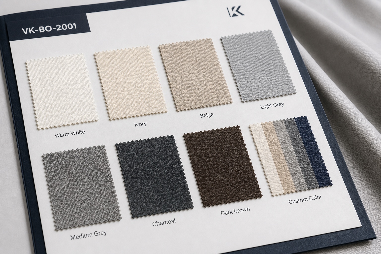 Real photographed fabric color card presentation with labeled samples including Warm White, Ivory, Beige, Light Grey, Medium Grey, Charcoal, Dark Brown, and Custom Color