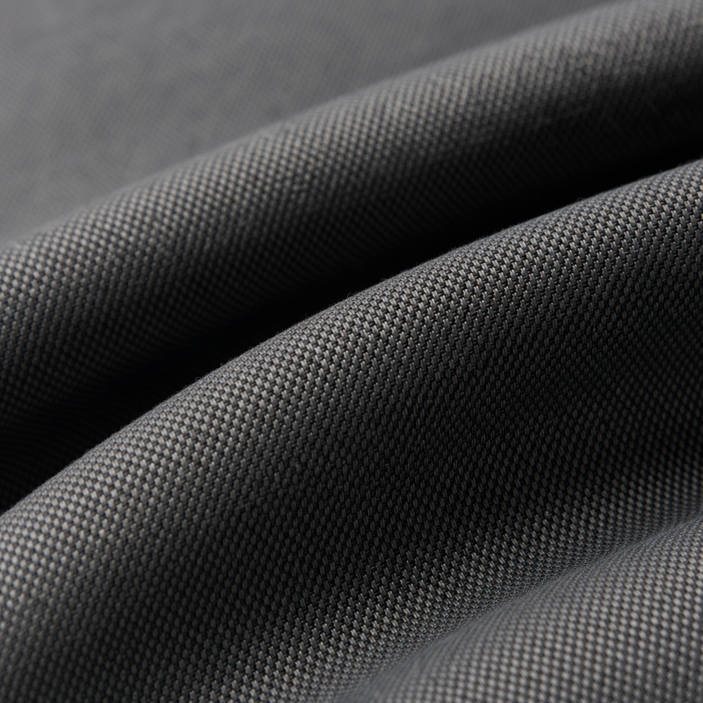 Macro close-up of VK-BO-1001 blackout curtain textile showing weave texture and soft drape folds