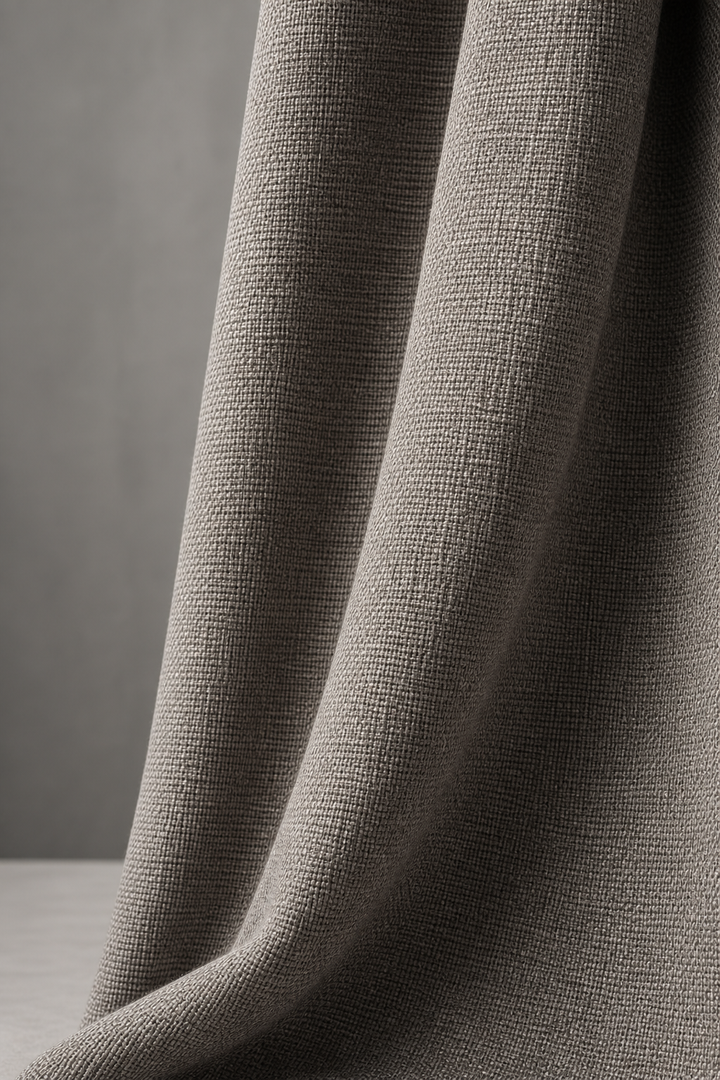 Medium-weight inherently flame-retardant drapery fabric with structured weave and tailored drape