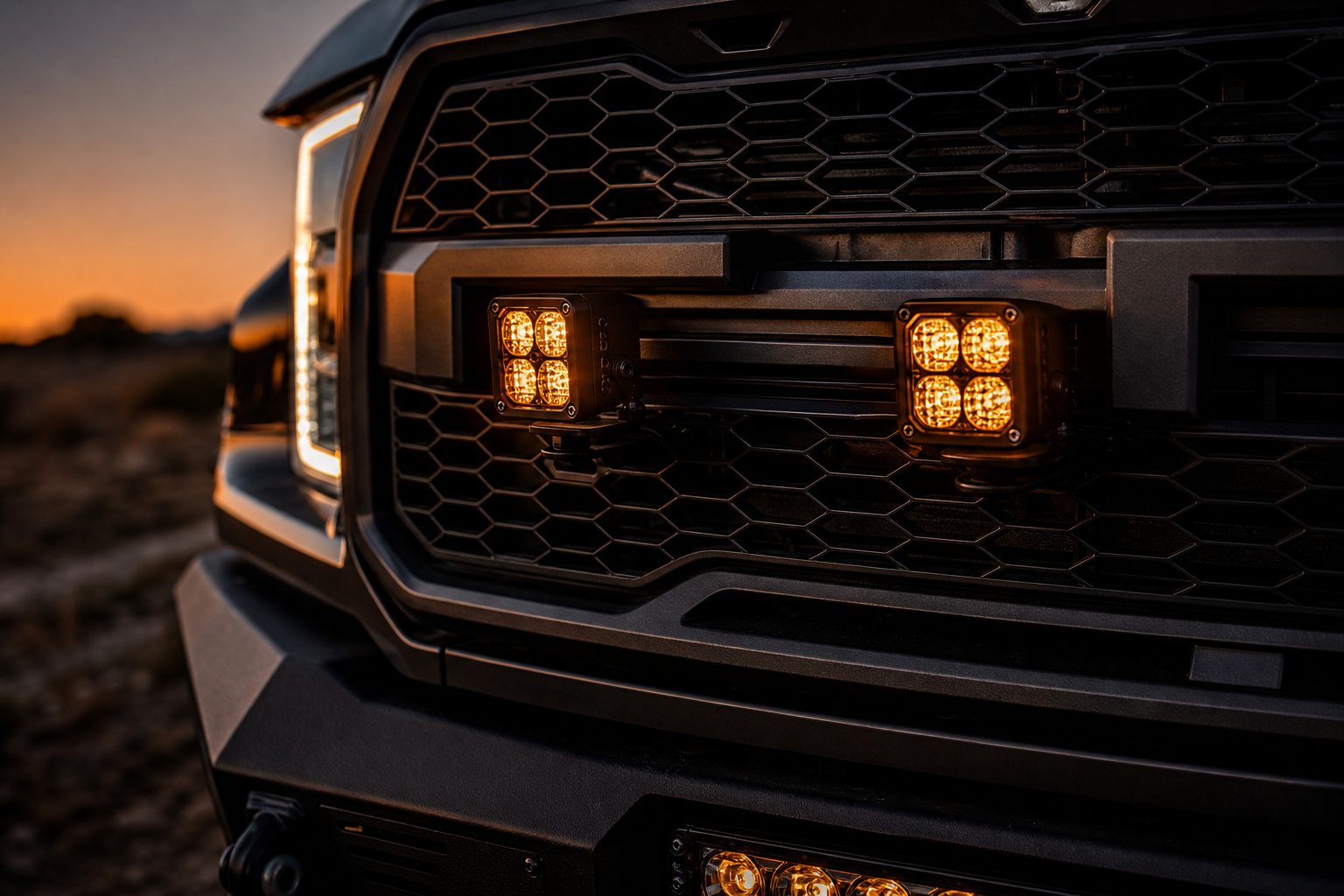 Front grille LED pod lighting with balanced amber glow at dusk