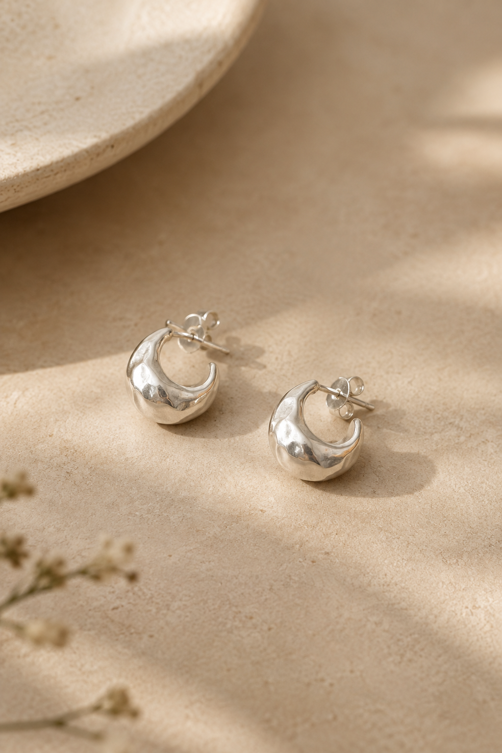Pair of small organic sterling silver pebble-shaped stud earrings
