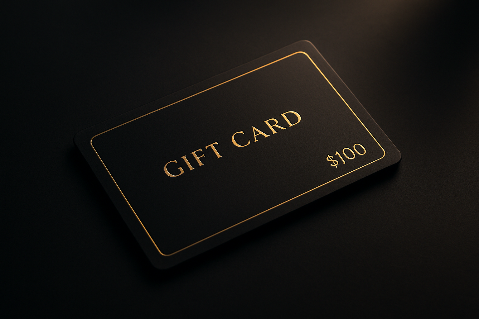 A sleek black premium gift card mockup with subtle gold accents and refined typography, set against a dark luxurious surface.