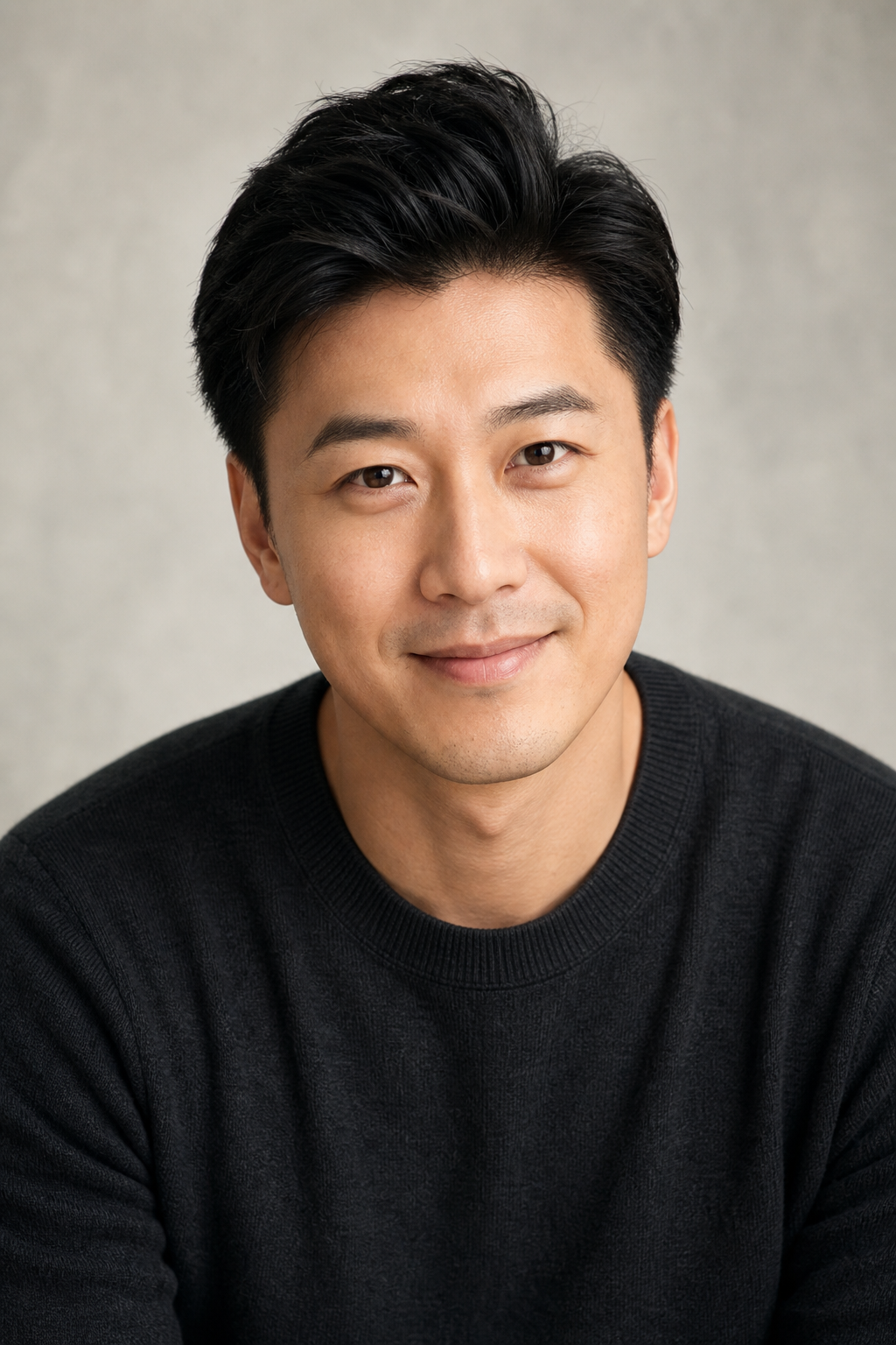 Professional headshot of Kelvin, a friendly commercial voice over actor in a neutral studio-style setting