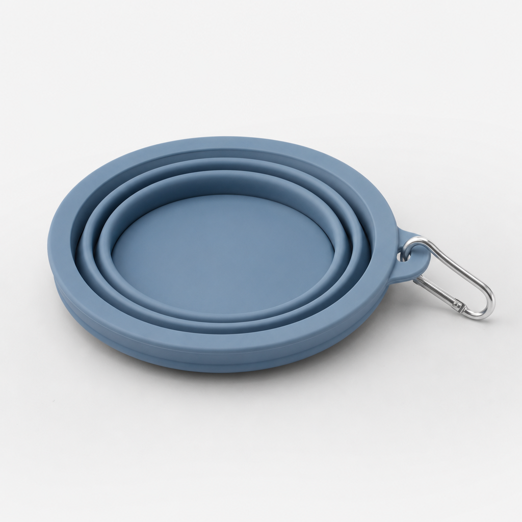 Blue collapsible silicone pet bowl in folded travel state