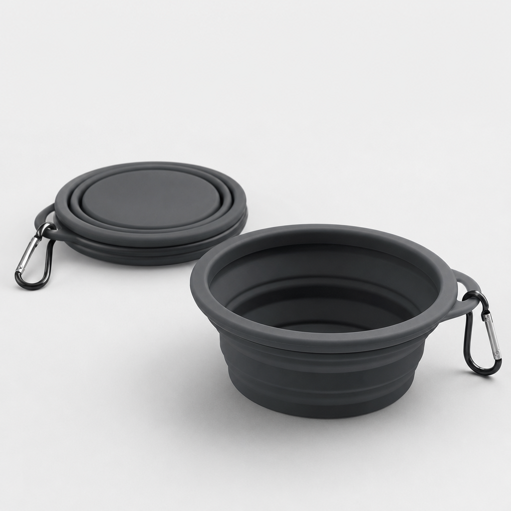 Compact foldable silicone travel bowl in deep charcoal with a slim stacked profile