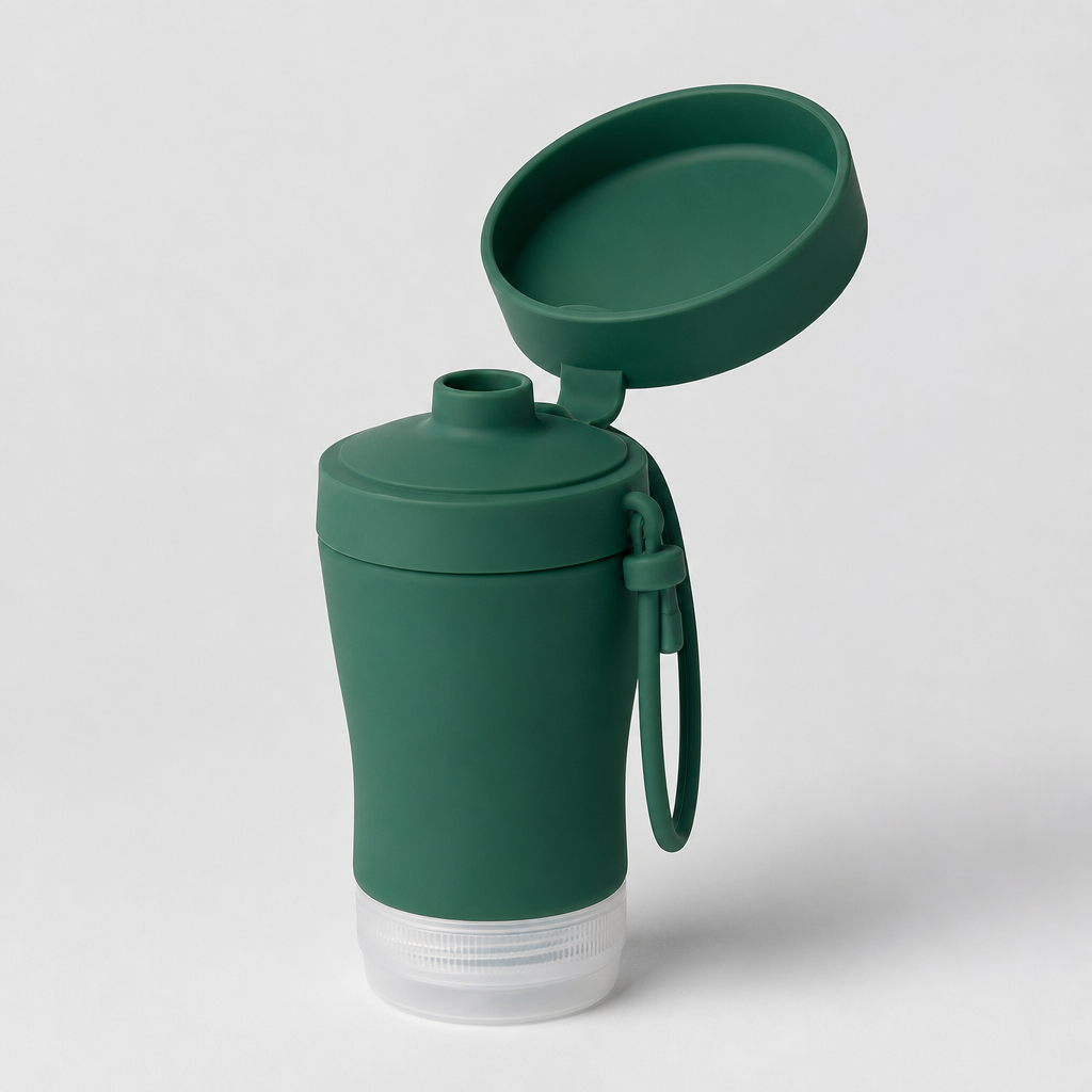 Flip-top silicone travel bottle with wide tray in deep green