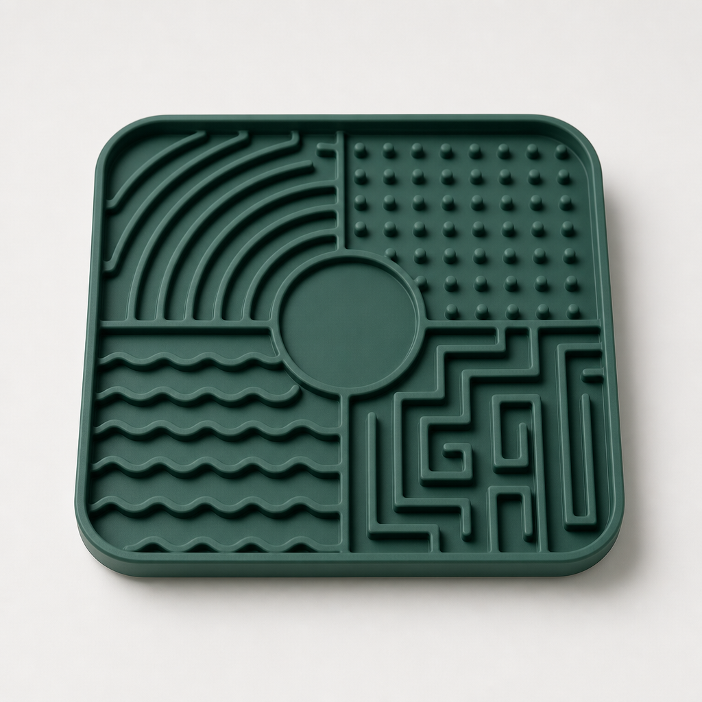 Square silicone puzzle lick mat with raised maze texture in deep green