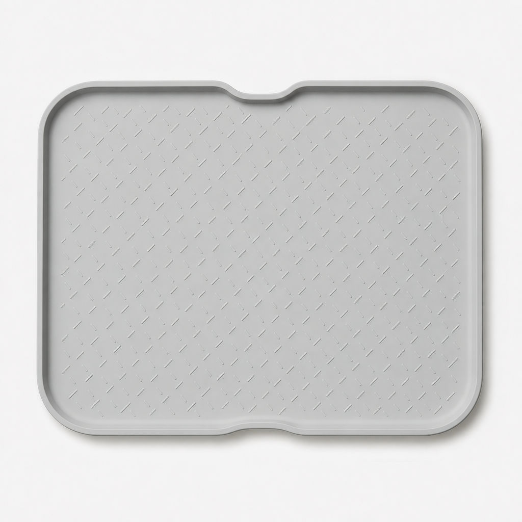 Light gray silicone feeding mat with raised edges and subtle texture