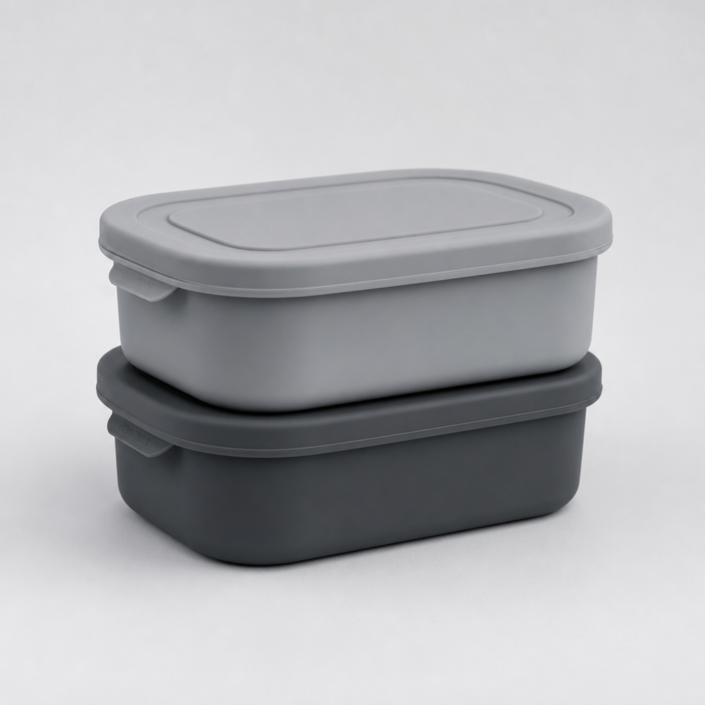 Set of two lidded silicone food containers in charcoal and soft gray