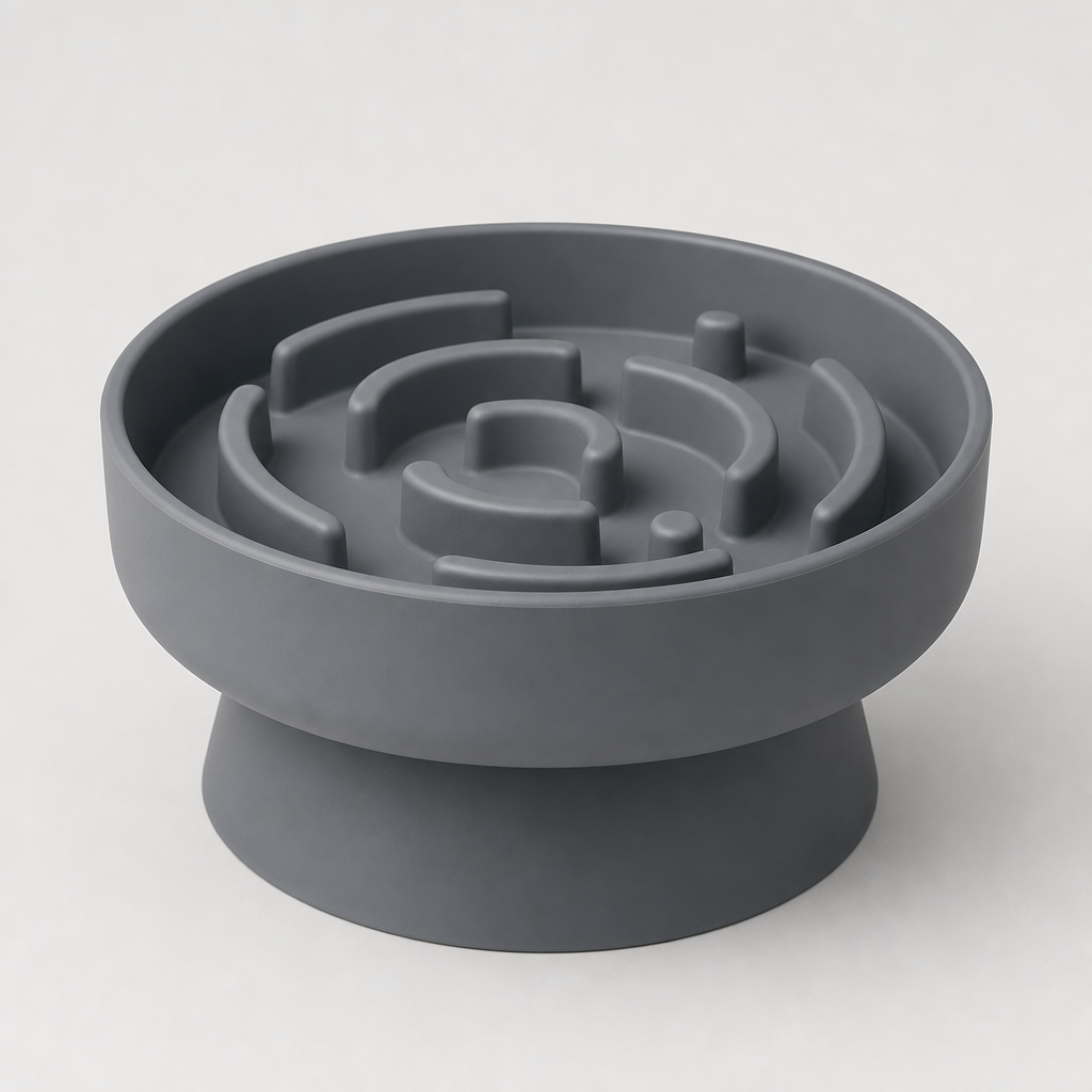 Elevated silicone slow feeder bowl in cool slate with a raised base and grooved top, photographed on a clean light gray background.