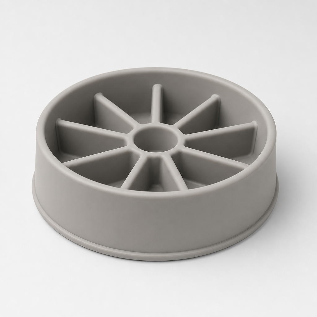 Round silicone slow feeder bowl in warm mist gray with radial grooves, photographed on a clean light gray background.