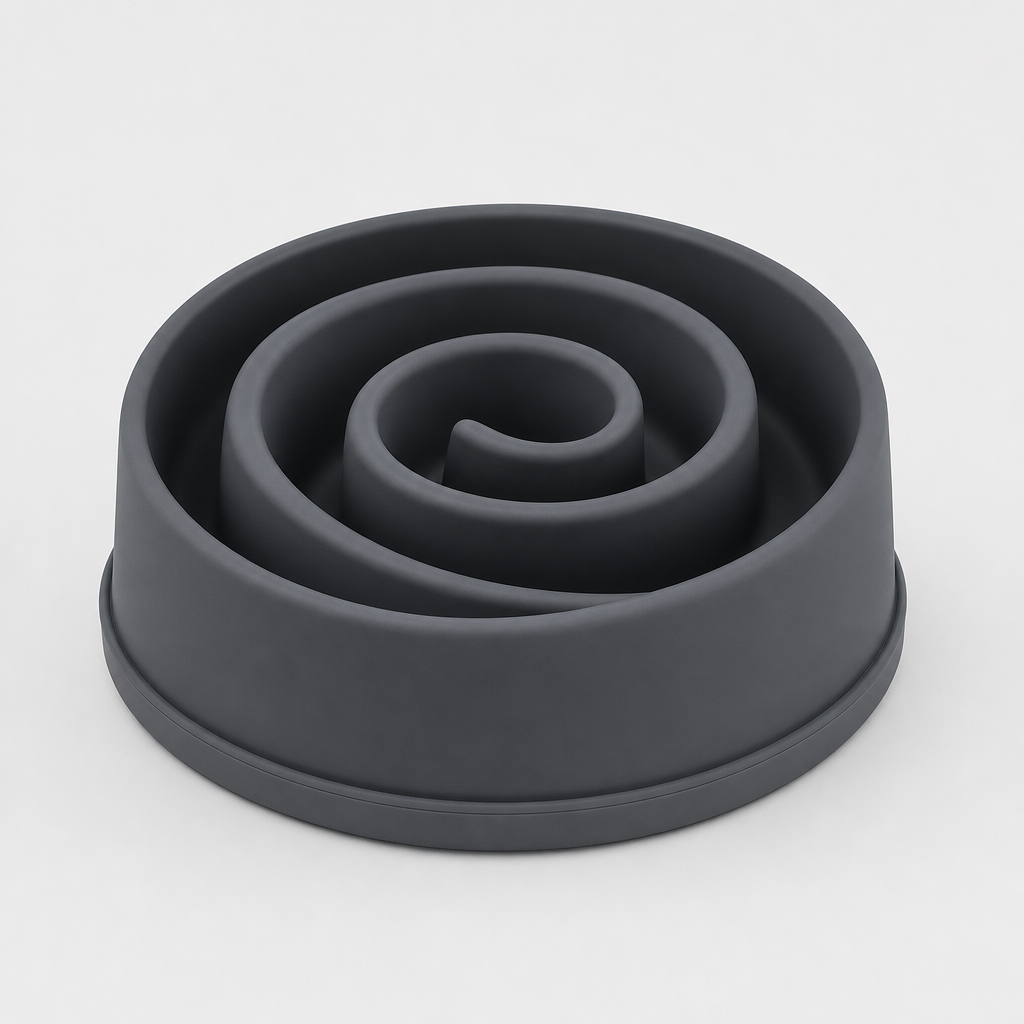 Spiral silicone slow feeder bowl in matte charcoal with deep winding channels, photographed on a clean light gray background.