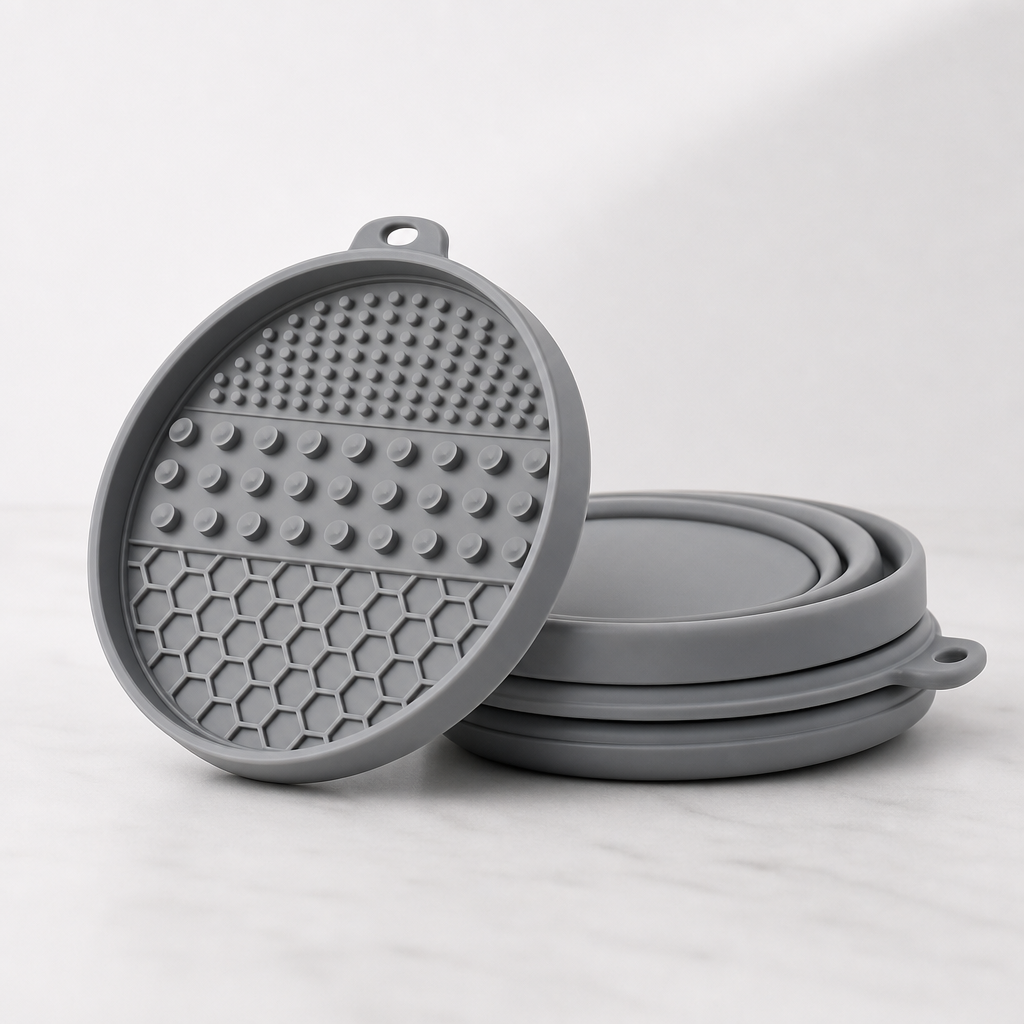 Portable silicone travel enrichment product in neutral gray with folding design