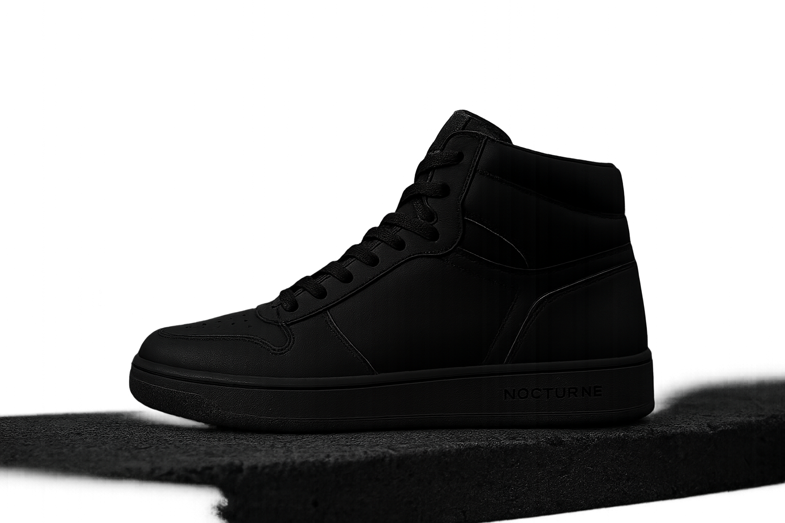 Nocturne High collection hero sneaker in matte black leather with graphite sole on an urban rooftop at dusk