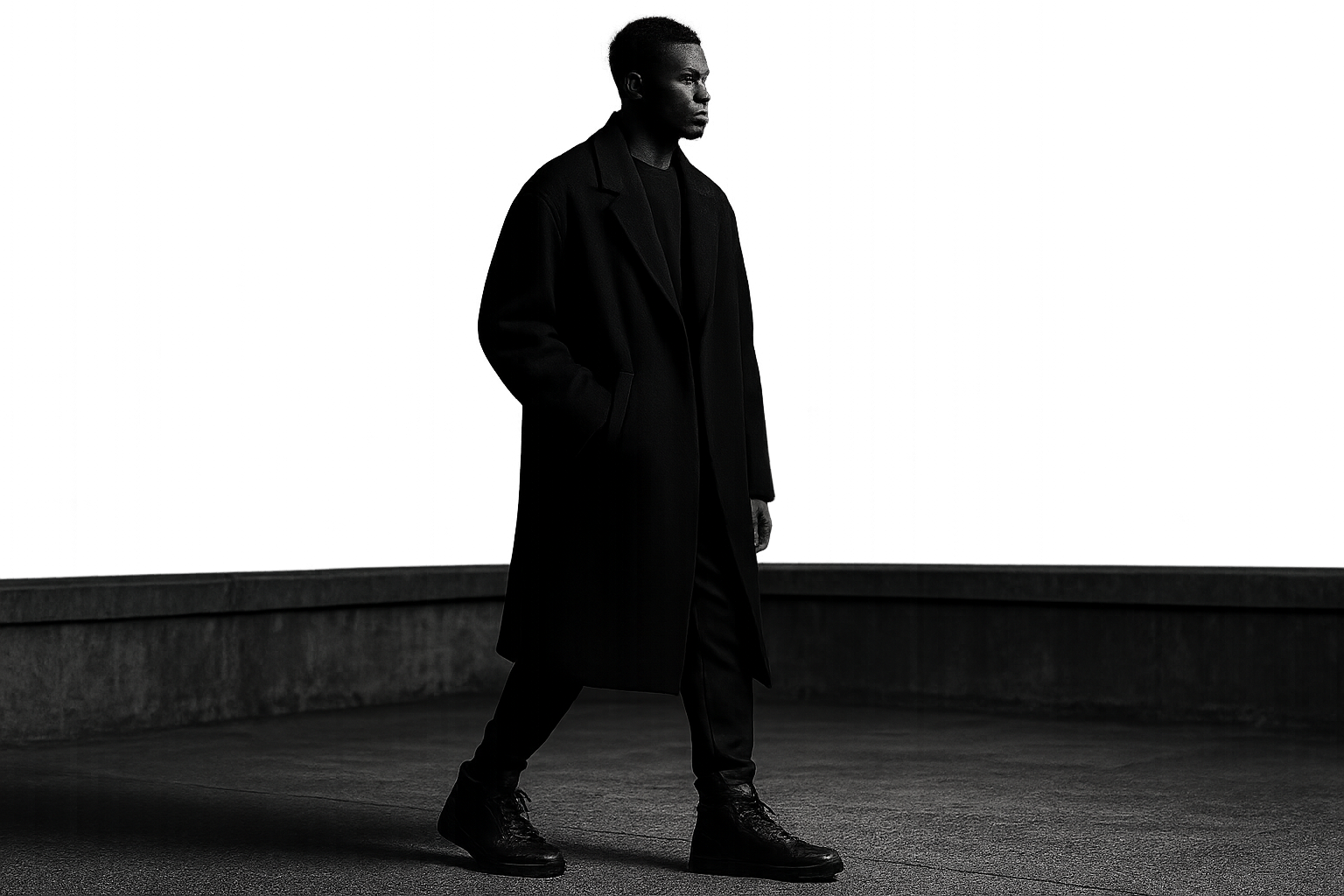 Editorial urban rooftop scene featuring a model in premium high-top sneakers at dusk with city skyline lights
