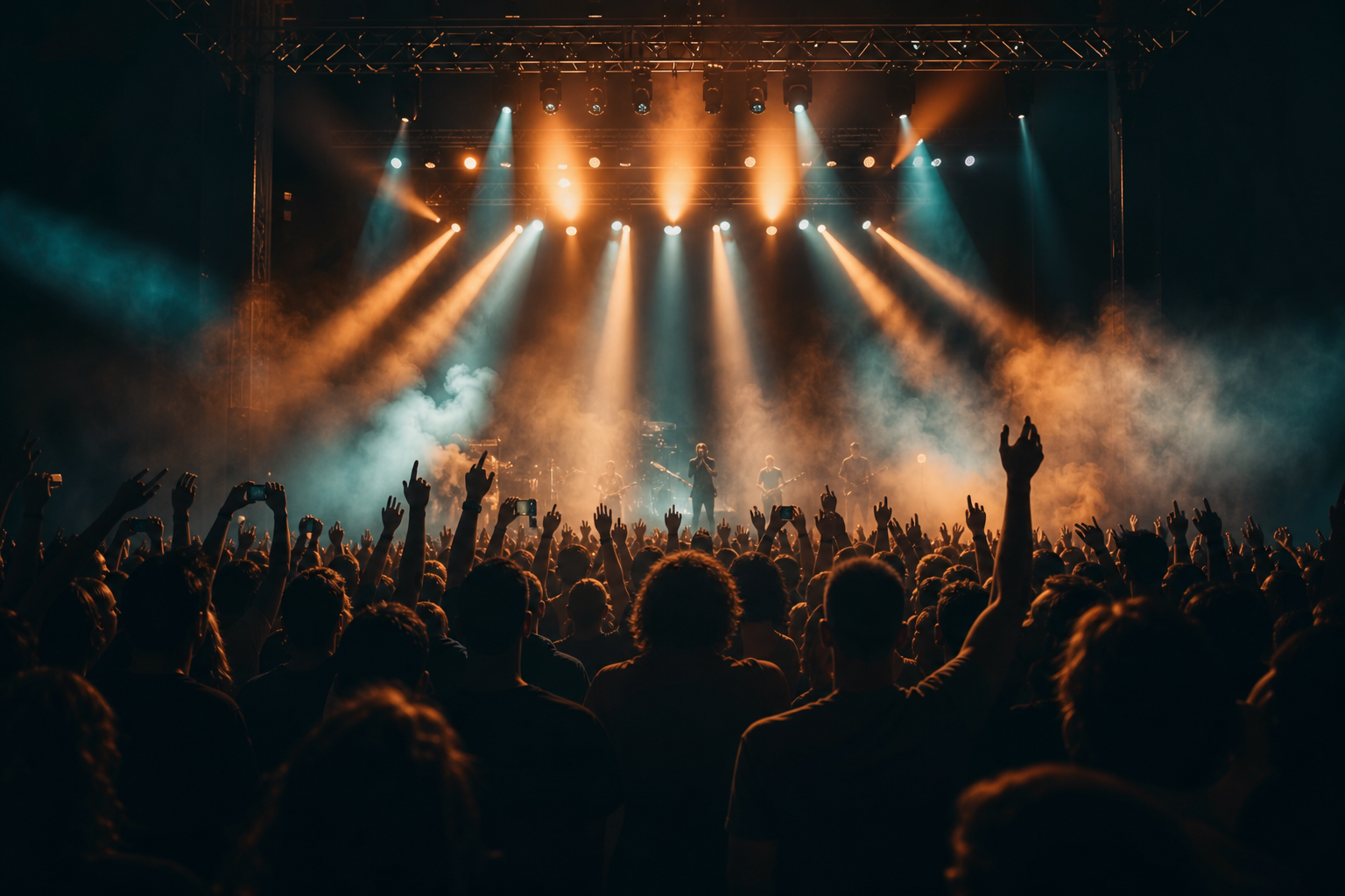 Live event crowd under moody stage lights and cinematic smoke
