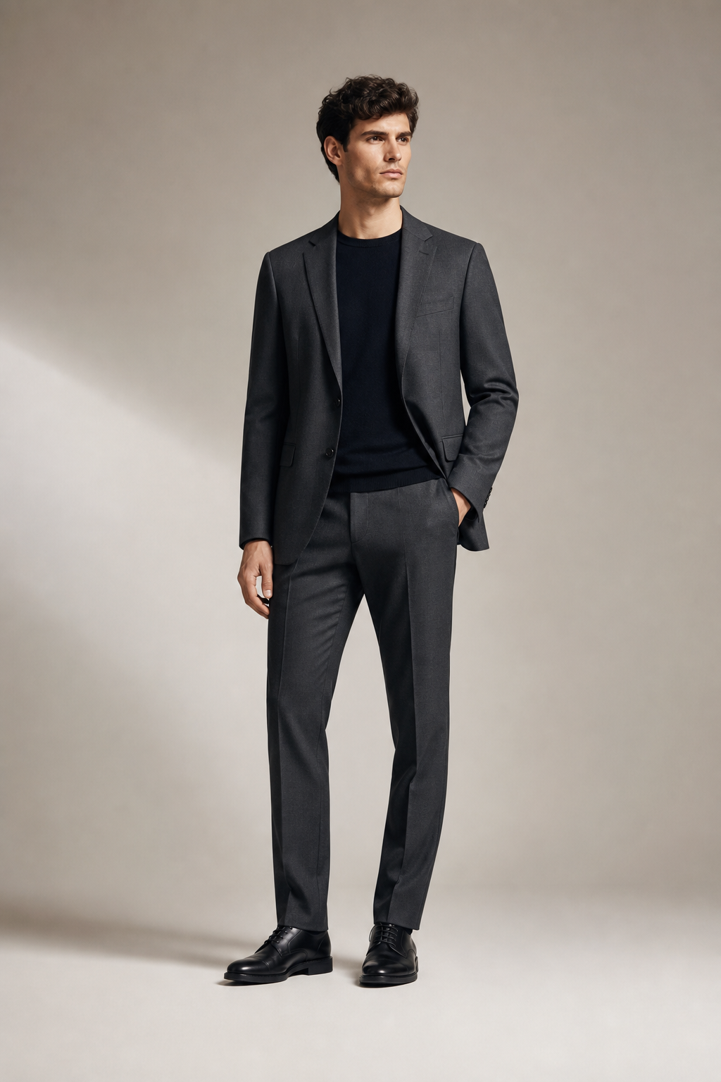 Front-facing full-length studio photo of a premium contemporary fashion outfit with clean tailoring and refined drape