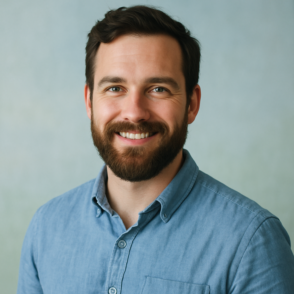 Bearded Caucasian man in a casual shirt, smiling