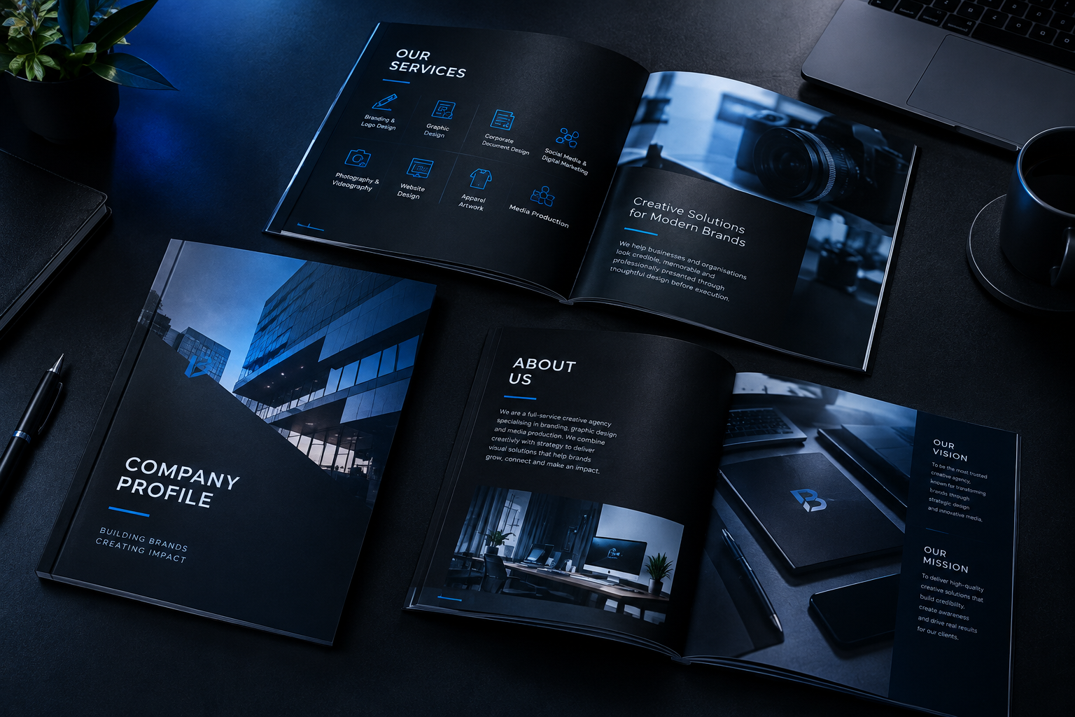 Wide mockup spread of multiple company profile document pages arranged on a dark desk